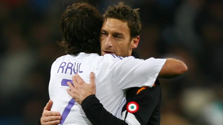 Roma's captain Francesco Totti (R) hugs