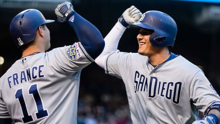 Manny Machado celebrates with Ty France during a game against the Diamondbacks.