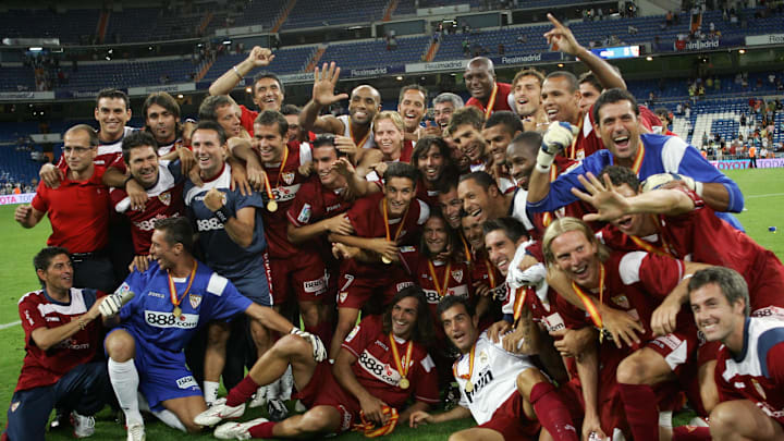 Sevilla players celebrate after beating