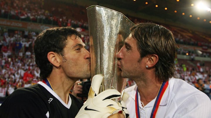 Sevilla players kisse their trophy after