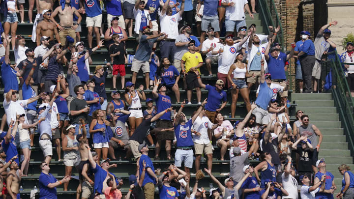 Cubs Fan Sends Phone Up The Wrigley Field Bleachers To Score Girl's Number,  Crowd Erupts When She Says Yes