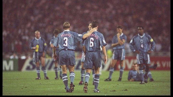 Stuart Pearce (left) consoles teammate Gareth Southgate