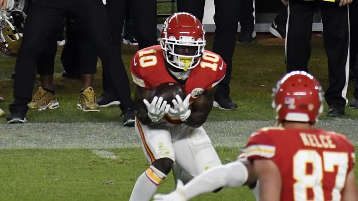Tyreek Hill catching a pivotal deep ball by Patrick Mahomes, which helped the Chiefs win Super Bowl LIV