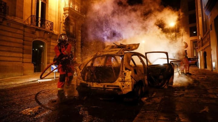Cars were torched amid fighting & rioting in Paris