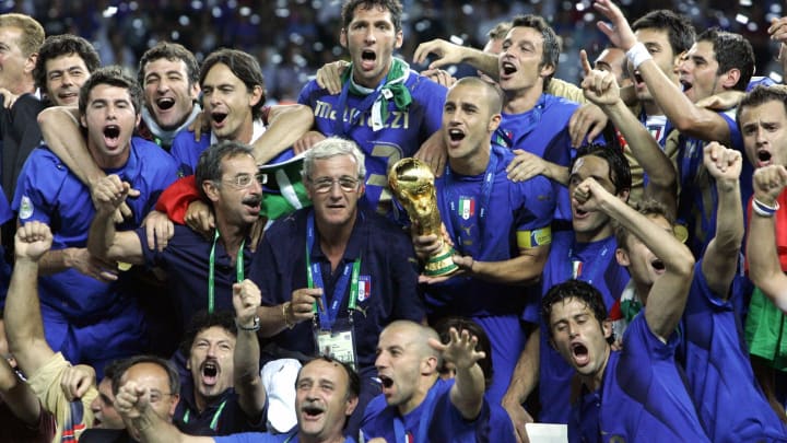 The Italian team celebrate with the trop