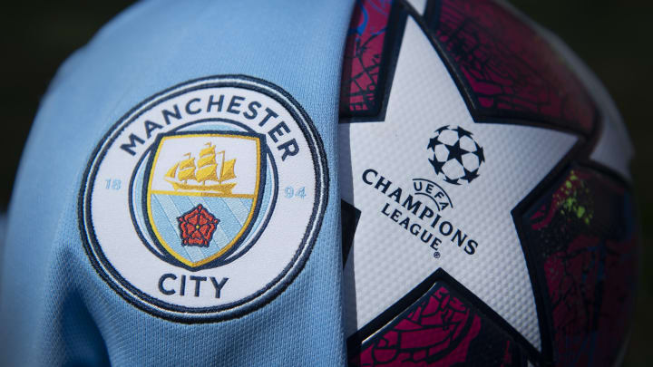 The badges of Manchester City and the Champions League.