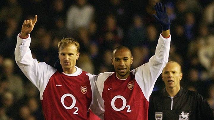 Thierry Henry of Arsenal celebrates scoring his 100th goal for Arsenal with Dennis Bergkamp of Thierry Henry of Arsenal celebrates scoring his 100th goal for Arsenal with Dennis Bergkamp of