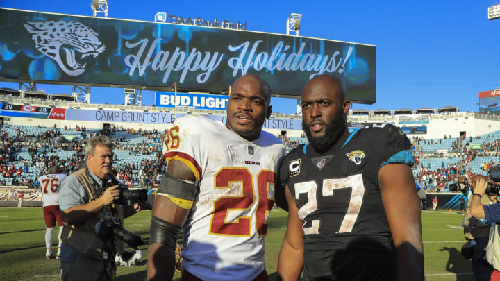 Washington Redskins RB Adrian Peterson with Jacksonville Jaguars RB Leonard Fournette