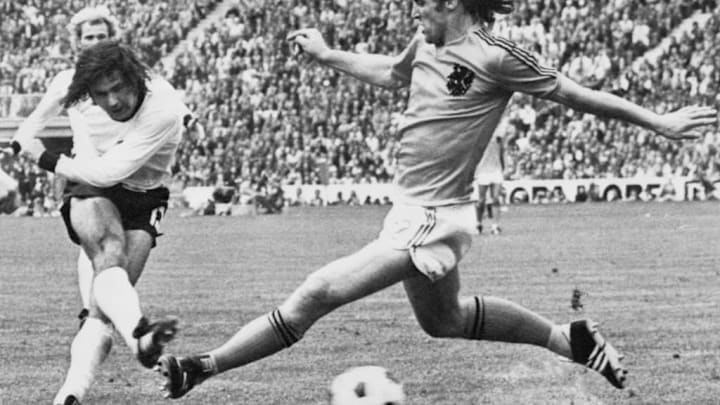 West German forward Gerd Muller (L) scores the sec
