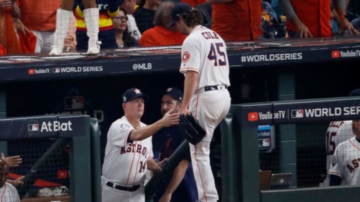 Gerrit Cole (center) enters the dugout during Game 1 of the 2019 World Series