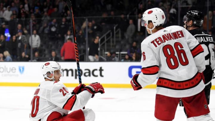 LOS ANGELES, CALIFORNIA - OCTOBER 15: Sebastian Aho #20 of the Carolina Hurricanes celebrate the empty net goal of Teuvo Teravainen #86 to take a 2-0 lead during the third period in a 2-0 Hurricanes win at Staples Center on October 15, 2019 in Los Angeles, California. (Photo by Harry How/Getty Images)