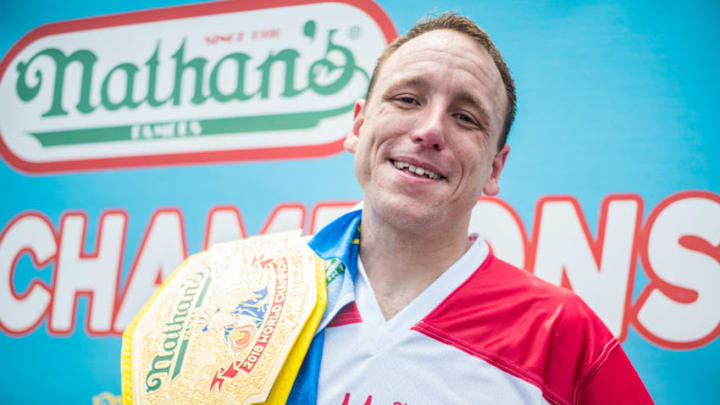 NEW YORK, NY - JULY 04: Joey Chestnut wins the 2018 Nathan's Hot Dog Eating Contest and sets a new record of eating 74 hot dogs in 10 minutes on July 4, 2018 in the Coney Island neighborhood of the Brooklyn borough of New York City. (Photo by Steven Ferdman/WireImage) NEW YORK, NY - JULY 04: Joey Chestnut wins the 2018 Nathan's Hot Dog Eating Contest and sets a new record of eating 74 hot dogs in 10 minutes on July 4, 2018 in the Coney Island neighborhood of the Brooklyn borough of New York City. (Photo by Steven Ferdman/WireImage)
