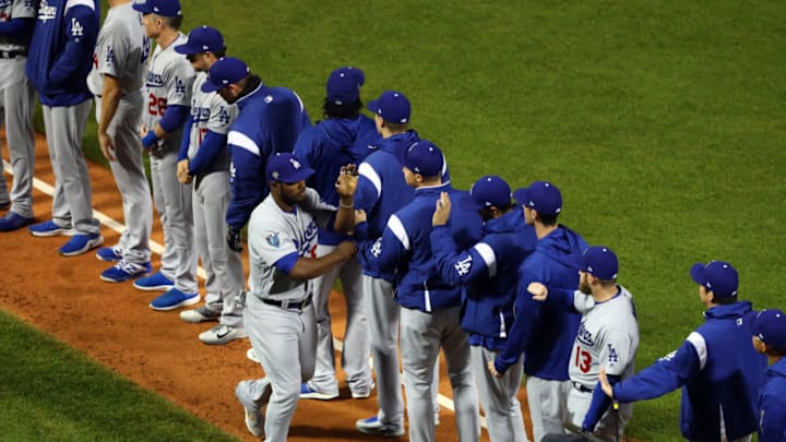 BOSTON, MA - OCTOBER 23: Yassiel Puig #66 of the Los Angeles Dodgers is greeted by teammates during player introductions prior to Game 1 of the 2018 World Series against the Boston Red Sox at Fenway Park on Tuesday, October 23, 2018 in Boston, Massachusetts. (Photo by Adam Glanzman/MLB Photos via Getty Images)