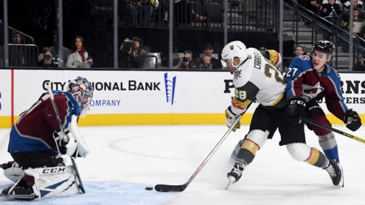 LAS VEGAS, NEVADA - OCTOBER 25: Philipp Grubauer #31 of the Colorado Avalanche makes a save against William Carrier #28 of the Vegas Golden Knights as Ryan Graves #27 of the Avalanche defends in the second period of their game at T-Mobile Arena on October 25, 2019 in Las Vegas, Nevada. The Avalanche defeated the Golden Knights 6-1. (Photo by Ethan Miller/Getty Images)