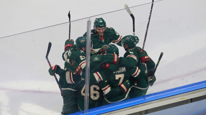 EDMONTON, ALBERTA - AUGUST 07: Nico Sturm #7 of the Minnesota Wild is congratulated by his teammates after scoring a goal against the Vancouver Canucks during the second period in Game Four of the Western Conference Qualification Round prior to the 2020 NHL Stanley Cup Playoffs at Rogers Place on August 07, 2020 in Edmonton, Alberta. (Photo by Jeff Vinnick/Getty Images)