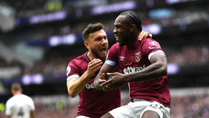LONDON, ENGLAND - APRIL 27: Michail Antonio of West Ham United celebrates with teammate Robert Snodgrass after scoring his team's first goal during the Premier League match between Tottenham Hotspur and West Ham United at Tottenham Hotspur Stadium on April 27, 2019 in London, United Kingdom. (Photo by Shaun Botterill/Getty Images)