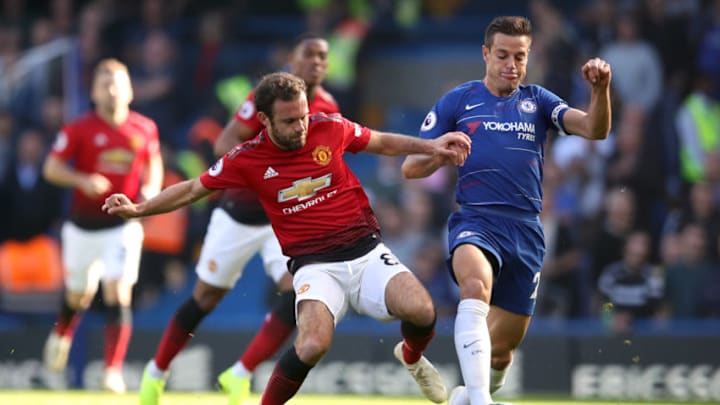 Manchester United's Juan Mata (left) and Chelsea's Cesar Azpilicueta battle for the ball during the Premier League match at Stamford Bridge, London. (Photo by Adam Davy/PA Images via Getty Images)