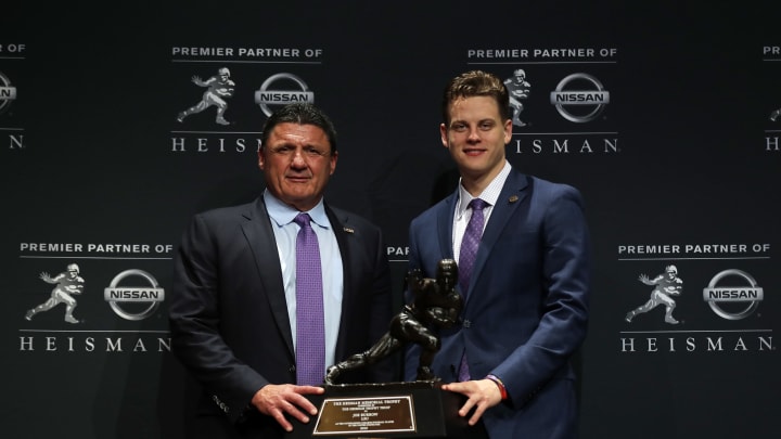 NEW YORK, NY – DECEMBER 14: Quarterback Joe Burrow of the LSU Tigers winner of the 85th annual Heisman Memorial Trophy poses for photos with head coach Ed Orgeron of the LSU Tigers (L) on December 14, 2019 at the Marriott Marquis in New York City. (Photo by Adam Hunger/Getty Images)
