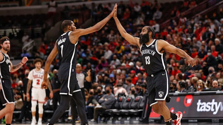 Nets guard James Harden (13) celebrates with forward Kevin Durant (7): Kamil Krzaczynski-USA TODAY Sports