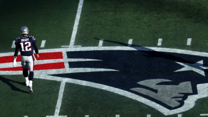 FOXBOROUGH, MASSACHUSETTS - DECEMBER 29: Tom Brady #12 of the New England Patriots walks to the bench over the Patriots logo during the game against the Miami Dolphins at Gillette Stadium on December 29, 2019 in Foxborough, Massachusetts. (Photo by Maddie Meyer/Getty Images)