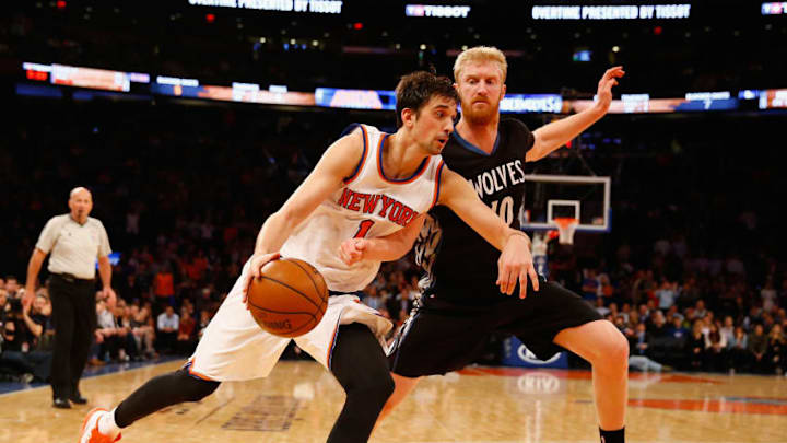 NEW YORK, NY - MARCH 19: Alexey Shved #1 of the New York Knicks drives against Chase Budinger #10 of the Minnesota Timberwolves during their game at Madison Square Garden on March 19, 2015 in New York City. NOTE TO USER: User expressly acknowledges and agrees that, by downloading and/or using this photograph, user is consenting to the terms and conditions of the Getty Images License Agreement. (Photo by Al Bello/Getty Images)
