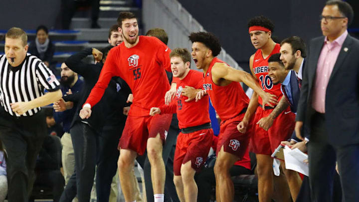 LOS ANGELES, CA - DECEMBER 29: The Liberty Flames bench celebrates during the second half against the UCLA Bruins at Pauley Pavilion on December 29, 2018 in Los Angeles, California. (Photo by Tim Bradbury/Getty Images)