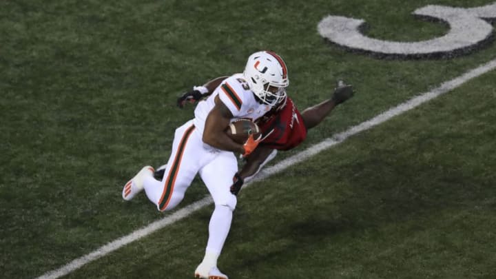 LOUISVILLE, KENTUCKY - SEPTEMBER 19: Cam 'Ron Harris #23 of the Miami Hurricanes runs the ball against the Louisville Cardinals at Cardinal Stadium on September 19, 2020 in Louisville, Kentucky. (Photo by Andy Lyons/Getty Images)