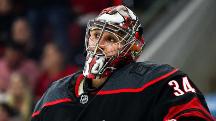 RALEIGH, NC - APRIL 15: Carolina Hurricanes goaltender Petr Mrazek (34) sits in net in a time out during a game between the Carolina Hurricanes and the Washington Capitals on April 15, 2019, at the PNC Arena in Raleigh, NC. (Photo by Greg Thompson/Icon Sportswire via Getty Images)
