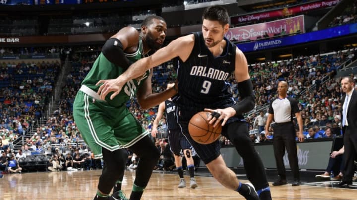 ORLANDO, FL - MARCH 16: Nikola Vucevic #9 of the Orlando Magic handles the ball against the Boston Celtics on March 16, 2018 at Amway Center in Orlando, Florida. NOTE TO USER: User expressly acknowledges and agrees that, by downloading and or using this photograph, User is consenting to the terms and conditions of the Getty Images License Agreement. Mandatory Copyright Notice: Copyright 2018 NBAE (Photo by Fernando Medina/NBAE via Getty Images)