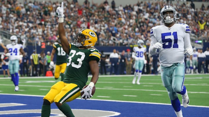 ARLINGTON, TEXAS - OCTOBER 06: Aaron Jones #33 of the Green Bay Packers scores against the Dallas Cowboys in the first quarter against the Green Bay Packers at AT&T Stadium on October 06, 2019 in Arlington, Texas. (Photo by Richard Rodriguez/Getty Images)