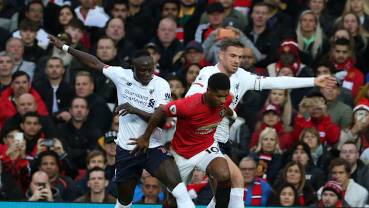 MANCHESTER, ENGLAND - OCTOBER 20: Marcus Rashford of Manchester United in action with Sadio Mane and Jordan Henderson of Liverpool FC during the Premier League match between Manchester United and Liverpool FC at Old Trafford on October 20, 2019 in Manchester, United Kingdom. (Photo by Matthew Peters/Manchester United via Getty Images)