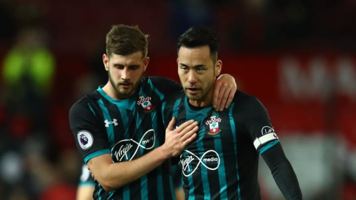 MANCHESTER, ENGLAND – DECEMBER 30: Jack Stephens and Maya Yoshida of Southampton embrace after the Premier League match between Manchester United and Southampton at Old Trafford on December 30, 2017 in Manchester, England. (Photo by Clive Mason/Getty Images)