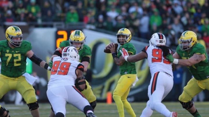 Nov 27, 2015; Eugene, OR, USA; Oregon State Beavers defensive tackle Kyle Peko (99) and Oregon State Beavers defensive end Baker Pritchard (95) rush as Oregon Ducks quarterback Vernon Adams Jr. (3) sets to throw the ball in the second quarter at Autzen Stadium. Mandatory Credit: Scott Olmos-USA TODAY Sports Nov 27, 2015; Eugene, OR, USA; Oregon State Beavers defensive tackle Kyle Peko (99) and Oregon State Beavers defensive end Baker Pritchard (95) rush as Oregon Ducks quarterback Vernon Adams Jr. (3) sets to throw the ball in the second quarter at Autzen Stadium. Mandatory Credit: Scott Olmos-USA TODAY Sports