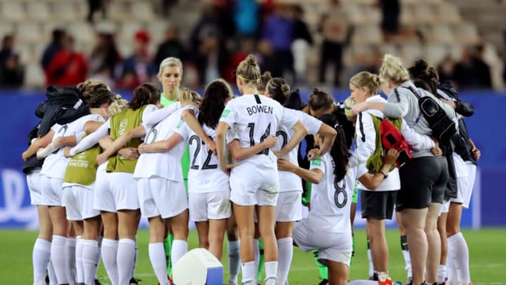 GRENOBLE, FRANCE - JUNE 15: New Zealand players look form a team huddle following their defeat in the 2019 FIFA Women's World Cup France group E match between Canada and New Zealand at Stade des Alpes on June 15, 2019 in Grenoble, France. (Photo by Elsa/Getty Images)