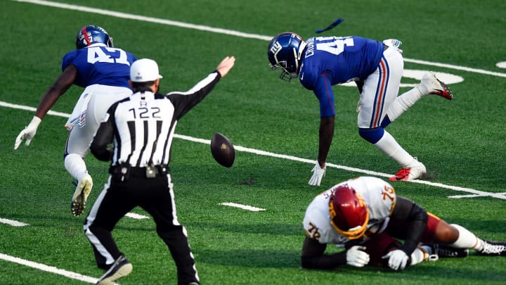 New York Giants linebacker Tae Crowder (48) picks up the ball after a Washington fumble, resulting in a Giants touchdown in the second half. The New York Giants defeat the Washington Football Team, 20-19, at MetLife Stadium on Sunday, Oct. 18, 2020, in East Rutherford.Nyg Vs Was
