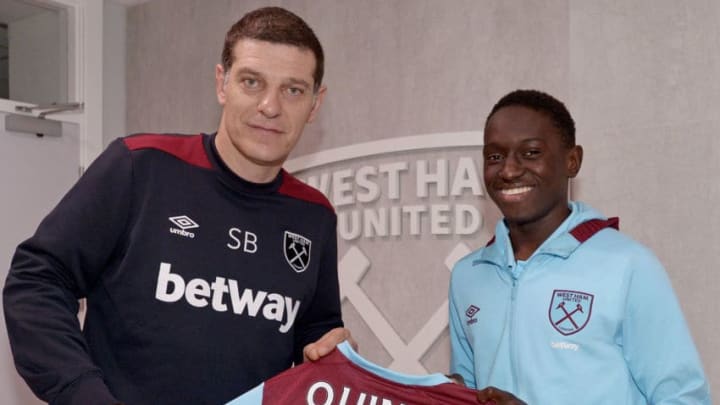 ROMFORD, ENGLAND - NOVEMBER 21: Domingos Quina of West Ham United after signing his first professional contract with Slaven Bilic (L) at Rush Green on November 21, 2016 in Romford, England. (Photo by Arfa Griffiths/West Ham United via Getty Images)