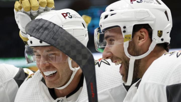 SEATTLE, WASHINGTON - MARCH 30: Brayden McNabb #3 celebrates a goal by Michael Amadio #22 of the Vegas Golden Knights against the Seattle Kraken during the third period at Climate Pledge Arena on March 30, 2022 in Seattle, Washington. (Photo by Steph Chambers/Getty Images)