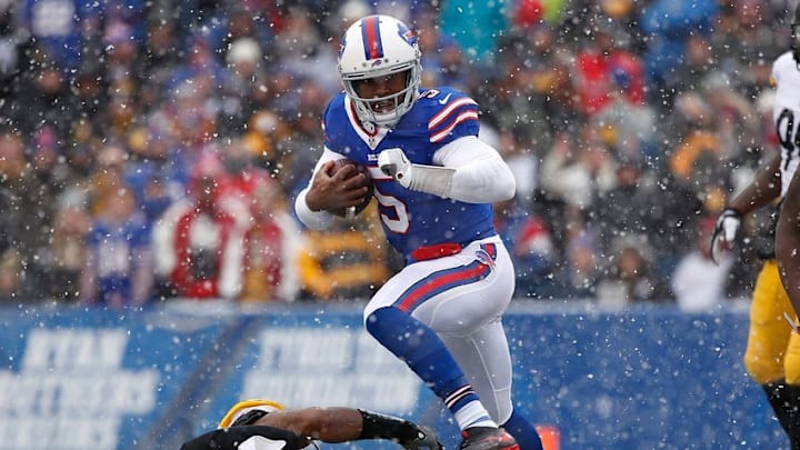 Dec 11, 2016; Orchard Park, NY, USA; Buffalo Bills quarterback Tyrod Taylor (5) jumps over Pittsburgh Steelers inside linebacker Ryan Shazier (50) during the first half at New Era Field. Mandatory Credit: Kevin Hoffman-USA TODAY Sports