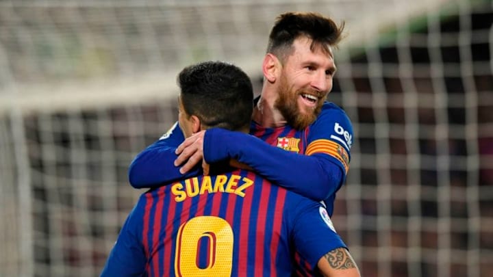 TOPSHOT - Barcelona's Argentinian forward Lionel Messi celebrates with Barcelona's Uruguayan forward Luis Suarez after scoring during the Spanish Copa del Rey (King's Cup) quarter-final second leg football match between Barcelona and Sevilla at the Camp Nou stadium in Barcelona on January 30, 2019. (Photo by LLUIS GENE / AFP) (Photo credit should read LLUIS GENE/AFP/Getty Images)
