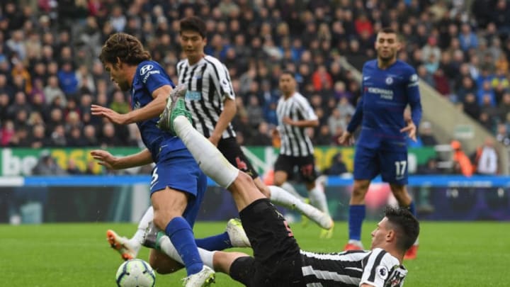 NEWCASTLE UPON TYNE, ENGLAND - AUGUST 26: Chelsea player Marcos Alonso is fouled by Newcastle defender Fabian Schar to give Chelsea a penalty during the Premier League match between Newcastle United and Chelsea FC at St. James Park on August 26, 2018 in Newcastle upon Tyne, United Kingdom. (Photo by Stu Forster/Getty Images)