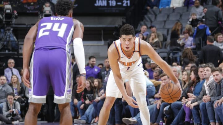 SACRAMENTO, CA - DECEMBER 29: Devin Booker #1 of the Phoenix Suns handles the ball against the Sacramento Kings on December 29, 2017 at Golden 1 Center in Sacramento, California. NOTE TO USER: User expressly acknowledges and agrees that, by downloading and or using this Photograph, user is consenting to the terms and conditions of the Getty Images License Agreement. Mandatory Copyright Notice: Copyright 2017 NBAE (Photo by Rocky Widner/NBAE via Getty Images)