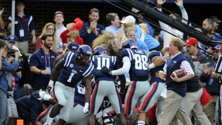 Oct 4, 2014; Oxford, MS, USA; Mississippi Rebels running back Jaylen Walton (6) celebrates with teammates after a touchdown pass during the second half against Alabama Crimson Tide at Vaught-Hemingway Stadium. Mandatory Credit: Christopher Hanewinckel-USA TODAY Sports
