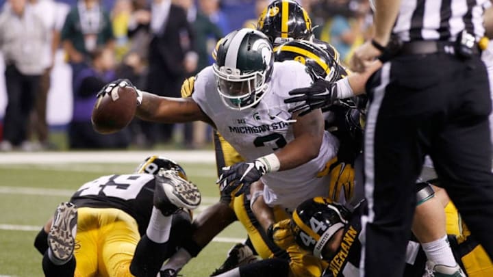INDIANAPOLIS, IN - DECEMBER 05: LJ Scott #3 of the Michigan State Spartans reaches into the end zone against the Iowa Hawkeyes in the Big Ten Championship at Lucas Oil Stadium on December 5, 2015 in Indianapolis, Indiana. (Photo by Joe Robbins/Getty Images)