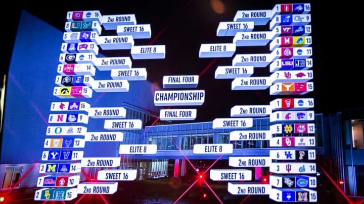The bracket for women's basketball teams is seen on a television screen at a NCAA Tournament Selection Sunday watch party, Sunday, March 13, 2022, at Carver-Hawkeye Arena in Iowa City, Iowa.220313 Iowa Wbb Selection 009 Jpg
