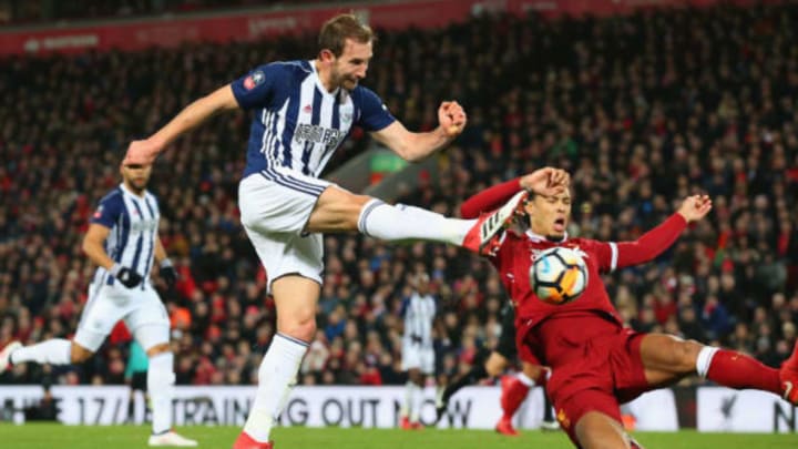 Craig Dawson of West Bromwich Albion takes a shot past Virgil van Dijk  in the build up to an own goal scored by Joel Matip. (Picture by Alex Livesey of Getty Images)