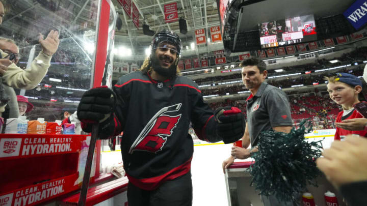 Jan 29, 2023; Raleigh, North Carolina, USA; Carolina Hurricanes defenseman Jalen Chatfield (5) comes off the ice after warmups past the fans against the Boston Bruins at PNC Arena. Mandatory Credit: James Guillory-USA TODAY Sports