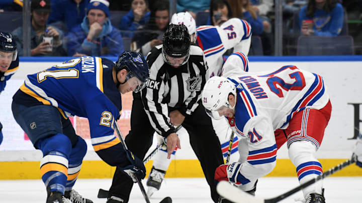 ST. LOUIS, MO. - DECEMBER 31: St. Louis Blues leftwing Alexander Steen (20) and New York Rangers center Brett Howden (21) face off during an NHL game between the New York Rangers and the St. Louis Blues on December 31, 2018, at Enterprise Center, St. Louis, MO. (Photo by Keith Gillett/Icon Sportswire via Getty Images)