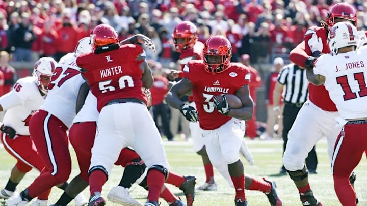 Oct 22, 2016; Louisville, KY, USA; Louisville Cardinals running back Jeremy Smith (34) runs the ball against the North Carolina State Wolfpack during the first quarter at Papa John