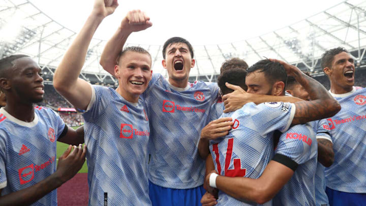 LONDON, ENGLAND - SEPTEMBER 19: Jesse Lingard of Manchester United celebrates with teammates Harry Maguire and Scott McTominay after scoring their side's second goal during the Premier League match between West Ham United and Manchester United at London Stadium on September 19, 2021 in London, England. (Photo by Julian Finney/Getty Images)