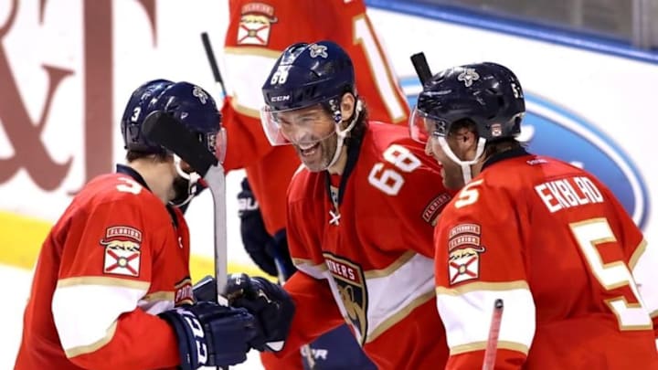 Oct 20, 2016; Sunrise, FL, USA; Florida Panthers right wing Jaromir Jagr (68) celebrates his goal against the Washington Capitals with defenseman Aaron Ekblad (5) and defenseman Keith Yandle (3) in the second period at BB&T Center. This is Jagr